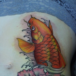 Koi fish tattoo adding to an existing piece by Cysen For any inquires check us out at http://goldenirontattoostudio.com/ or to book an appointment contact (416)-903-1624 during opening hours 11:00AM-8:00PM