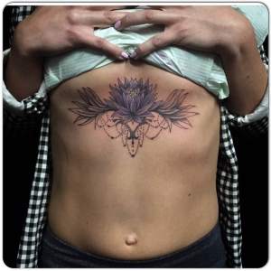 Custom lotus sternum tattooed by Greg For any inquires check us out at http://goldenirontattoostudio.com/ or to book an appointment contact (647) 347-9363 during opening hours 11:00AM-8:00PM