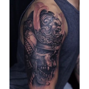 Realistic black and grey skull Samurai arm tattoo. For any inquires check us out at http://goldenirontattoostudio.com/ or to book an appointment contact (647) 347-9363 during opening hours 11:00AM-8:00PM