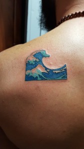 Emoji water wave tattoo done by Phillip. For all inquires check us out at http://goldenirontattoostudio.com/