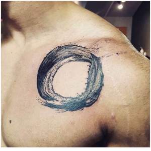 Ink splash circle tattoo by Phillip. For all inquires check us out at http://goldenirontattoostudio.com/